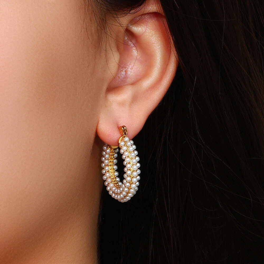 Embellished White Diamonds & Gold Plated Hoop Earrings on Ears by The Happiness Store
